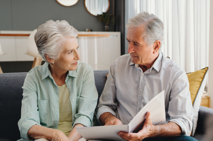 a texas elderly couple talking on the couch about the disadvantages of a an estate planning trust