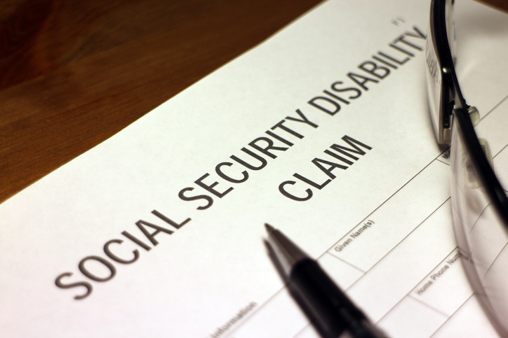 Someone filling out Social Security Disability Claim