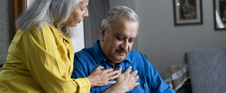 elderly man suffering from heart disease and chest pain