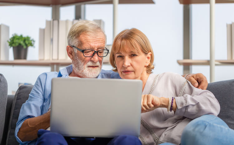 Older couple digital estate planning on the computer