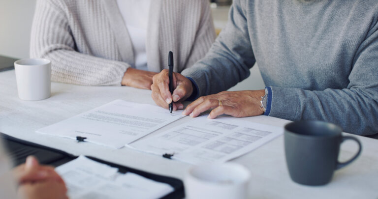 Elderly couple signing a trust